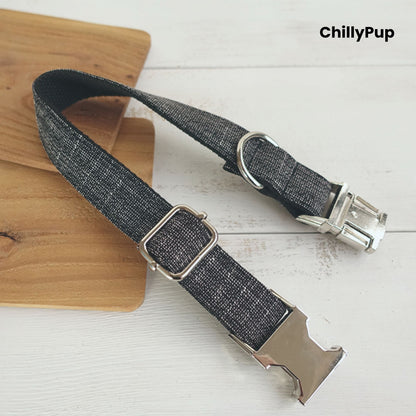 Grey dog collar with metal clip on a wooden board, branded 'ChillyPup'.