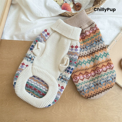 Knitted dog jumper with colourful pattern on a white surface, brand 'ChillyPup' visible.