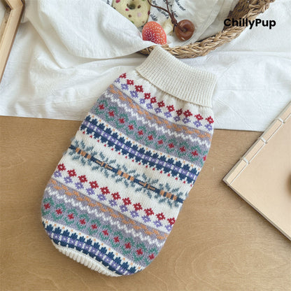 Knitted dog jumper with colourful pattern on a white surface, brand 'ChillyPup' visible.