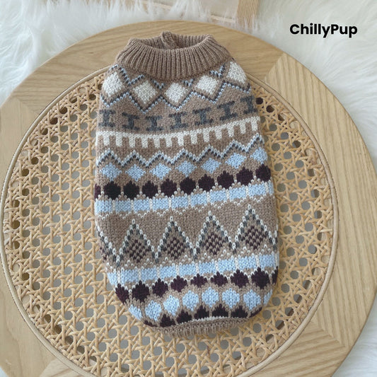 Patterned dog sweater on a wooden surface with 'ChillyPup' branding.